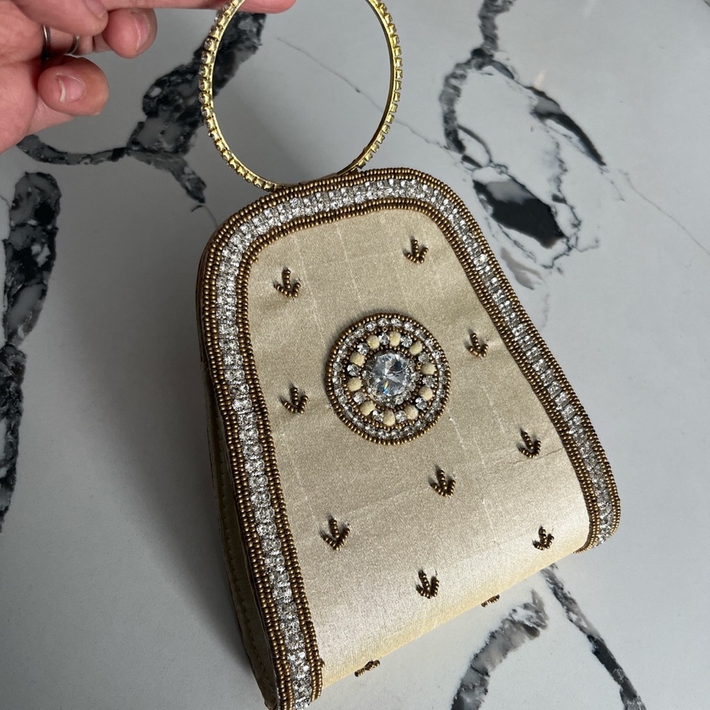 Vintage wristlet purse with embroidered rhinestones. Super cute